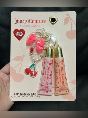Juicy Couture lip gloss set that includes a beaded cherry keychain